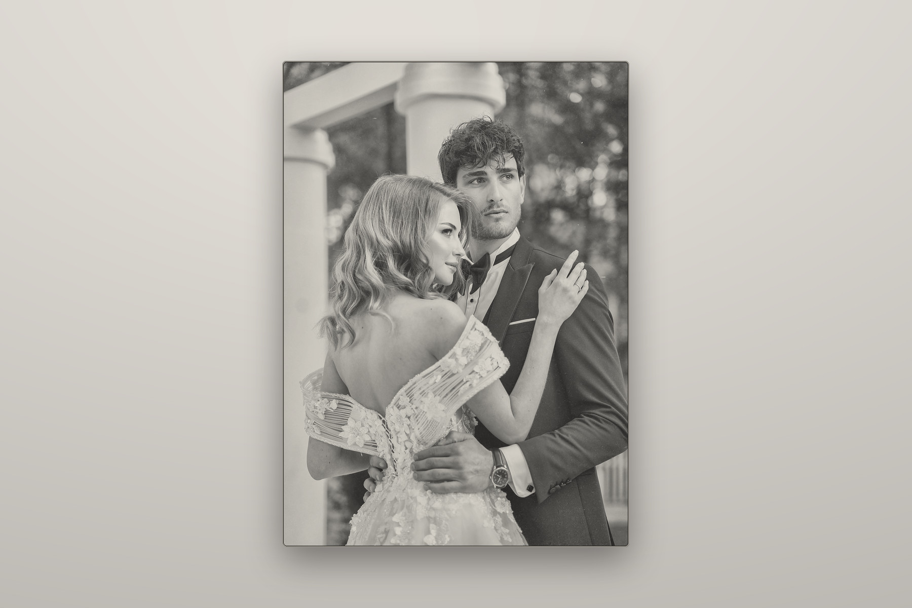 A wedding photograph engraved in grayscale into a black anodised steel plate